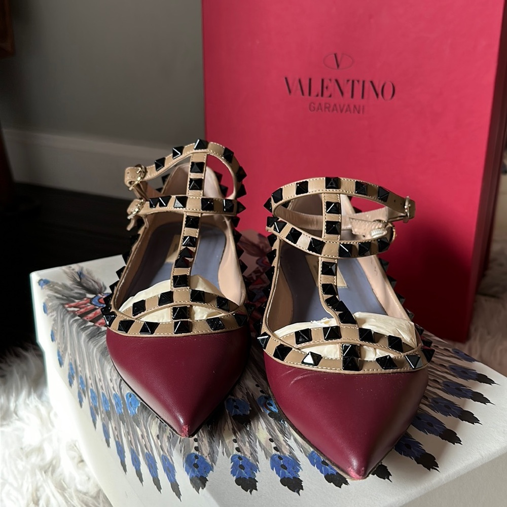 Valentino Garavani Rock Stud flats in burgundy with black studs